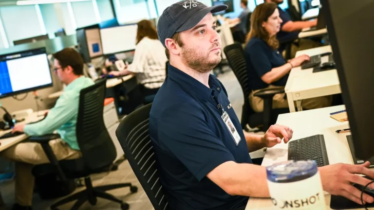 Moonshot employee working in a busy office